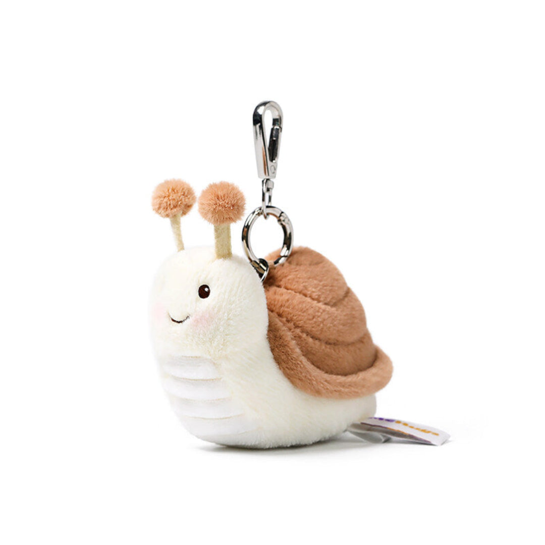 Plush snail keychain with a white body and brown shell on a white background