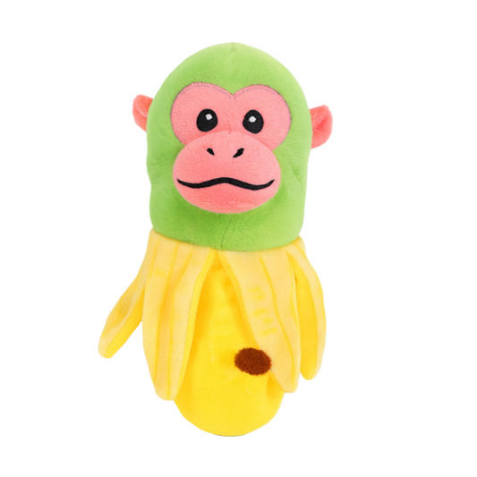 Plush toy shaped like a banana with a monkey face on a white background