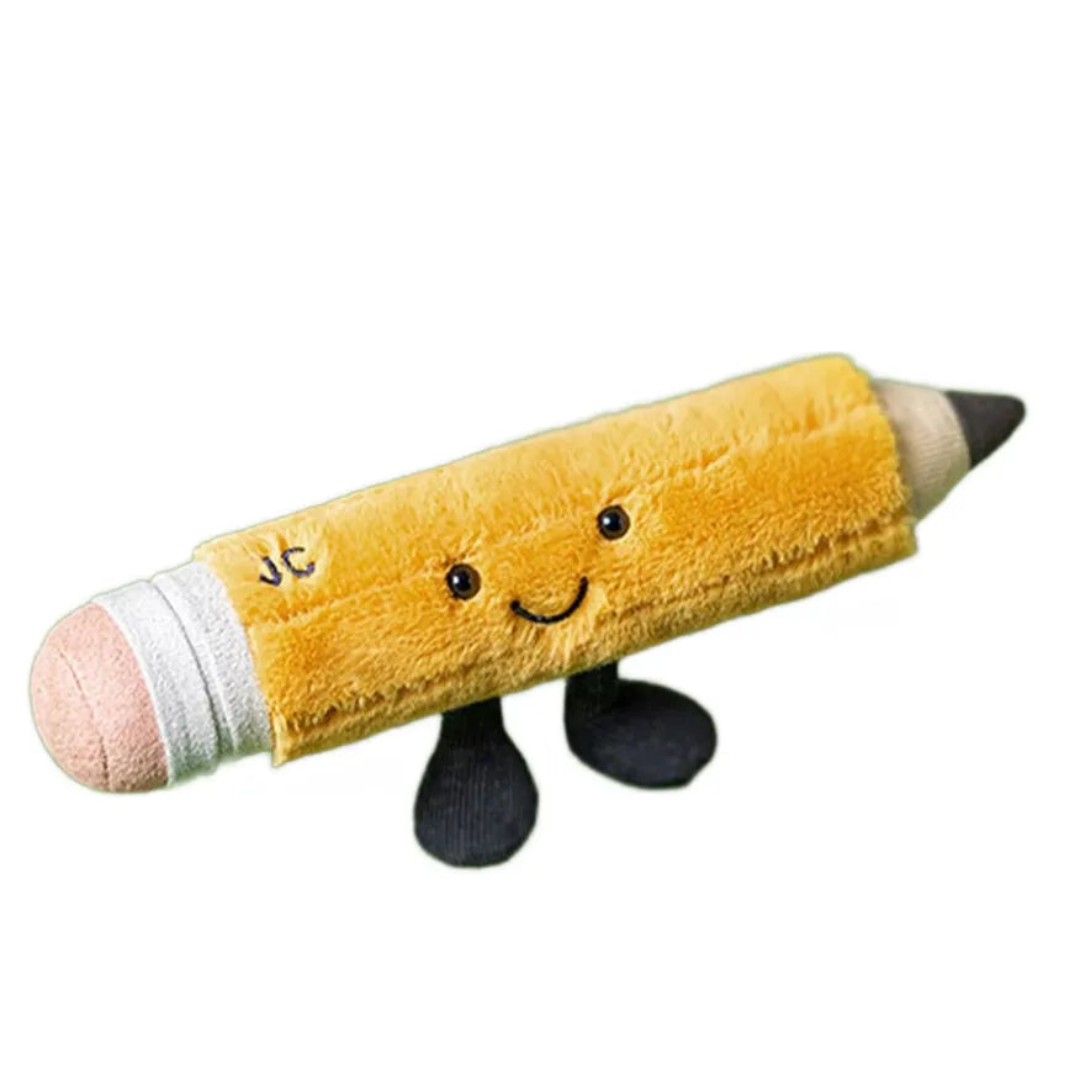Plush toy shaped like a yellow pencil with a smiling face on a white background