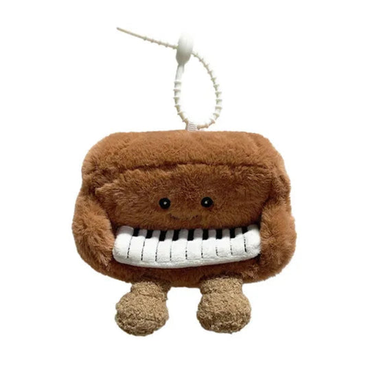 Plush toy piano character on a white background
