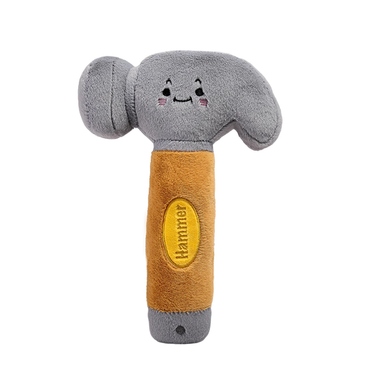 Plush toy hammer with a smiling face on a white background