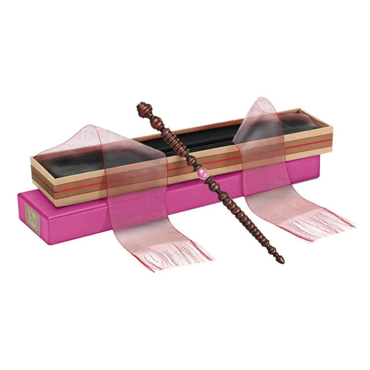 Wooden wand with pink accents in a decorative box on a white background
